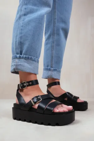 LAYLA WIDE FIT BUCKLE STRAP PLATFORM SANDALS IN BLACK FAUX LEATHER